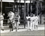 Students Hold Their Textbooks While Exiting a Classroom at Berkeley Preparatory School in Tampa, Florida, B by Skip Gandy