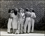 A Clique of Students Chat on the Sidewalk Between Classes at Berkeley Preparatory School in Tampa, Florida