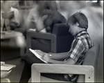 A Boy Does His Homework in an Armchair at Berkeley Preparatory School in Tampa, Florida, A