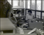 Two Girls Whisper While Reading in the Library at Berkeley Preparatory School in Tampa, Florida by Skip Gandy