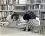 Three Students Study at a Table in the Library at Berkeley Preparatory School in Tampa, Florida, A by Skip Gandy