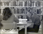 A Girl Reads at a Desk in the Library at Berkeley Preparatory School in Tampa, Florida by Skip Gandy