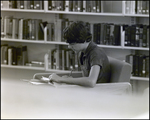 A Boy Does His Homework in an Armchair at Berkeley Preparatory School in Tampa, Florida, B