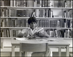 A Boy Reads a Sports Illustrated Magazine in the Library at Berkeley Preparatory School in Tampa, Florida