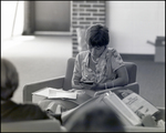 A Student Uses a Calculator While Studying in the Library at Berkeley Preparatory School in Tampa, Florida by Skip Gandy