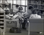 A Boy Studies in the Library With His Feet Elevated at Berkeley Preparatory School in Tampa, Florida