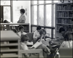 A School Administrator Oversees Students Studying in the Library at Berkeley Preparatory School in Tampa, Florida by Skip Gandy