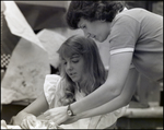 An Art Teacher Helps Her Student With a Project at Berkeley Preparatory School in Tampa, Florida, A by Skip Gandy