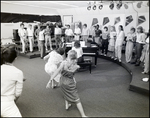 Students Dance Before a Chorus During Music Class at Berkeley Preparatory School in Tampa, Florida, A by Skip Gandy