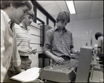 Three Boys Operate a Circuit Board at Berkeley Preparatory School in Tampa, Florida, A by Skip Gandy