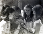 Five Girls Appreciate a Small Bouquet of Flowers at Berkeley Preparatory School in Tampa, Florida, A by Skip Gandy