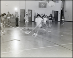 Students Play a Game of Hockey in the Gymnasium at Berkeley Preparatory School in Tampa, Florida, B by Skip Gandy