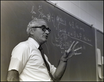 A Math Teacher Explains Equations on the Chalkboard at Berkeley Preparatory School in Tampa, Florida, A by Skip Gandy