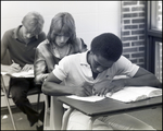 Three Boys Write in Concentration During Class at Berkeley Preparatory School in Tampa, Florida, A by Skip Gandy