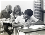 Three Boys Write in Concentration During Class at Berkeley Preparatory School in Tampa, Florida, B by Skip Gandy