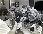 A Teacher Shows His Students Two Lenses During Class at Berkeley Preparatory School in Tampa, Florida, C by Skip Gandy