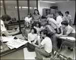 A Teacher Shows His Students Two Lenses During Class at Berkeley Preparatory School in Tampa, Florida, D by Skip Gandy