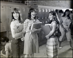 Three Girls Laugh Conspiratorially While Chatting by the Lockers at Berkeley Preparatory School in Tampa, Florida, A by Skip Gandy