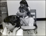 A Girl Giggles From Her Seat in Class at Berkeley Preparatory School in Tampa, Florida by Skip Gandy