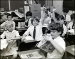 Two Children Raise Their Hands in Class at Berkeley Preparatory School in Tampa, Florida by Skip Gandy