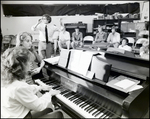 An Instructor Plays Piano With a Student by Her Side at Berkeley Preparatory School in Tampa, Florida, A by Skip Gandy