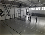 Students Play Basketball in the Gymnasium at Berkeley Preparatory School in Tampa, Florida, A by Skip Gandy