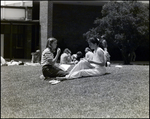 Two Girls Study in the Grass Outside Berkeley Preparatory School in Tampa, Florida, A by Skip Gandy