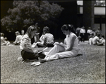 Two Girls Study in the Grass Outside Berkeley Preparatory School in Tampa, Florida, B by Skip Gandy