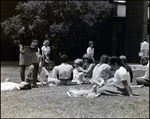 A Clique of Students Read and Lounge in the Grass Outside Berkeley Preparatory School in Tampa, Florida