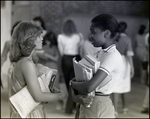 Two Girls Chat While Holding Their Textbooks at Berkeley Preparatory School in Tampa, Florida by Skip Gandy