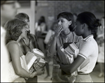 Four Girls Gossip While Holding Their Textbooks at Berkeley Preparatory School in Tampa, Florida by Skip Gandy