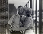 A Woman Kisses Her Partner on the Cheek at Berkeley Preparatory School in Tampa, Florida by Skip Gandy