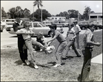 Boys Roughhouse in the Grass Outside Berkeley Preparatory School in Tampa, Florida by Skip Gandy