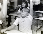 A Girl Raises Her Hand Excitedly at Berkeley Preparatory School in Tampa, Florida by Skip Gandy