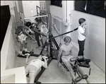 Five Boys Use Exercise Equipment at Berkeley Preparatory School in Tampa, Florida, A by Skip Gandy