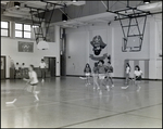 Students Play a Game of Hockey in the Gymnasium at Berkeley Preparatory School in Tampa, Florida, E by Skip Gandy