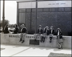 Students Sit Atop the Campus Nameplate in Freedom Plaza at Berkeley Preparatory School in Tampa, Florida, A by Skip Gandy