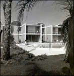 A Resident Reads by the Pool at Beverly Apartments in Tampa, Florida, B by Skip Gandy