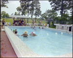 Adults Swim in and Lounge by a Community Pool in Beverly Hills, Florida, A