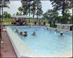 Adults Swim in and Lounge by a Community Pool in Beverly Hills, Florida, C