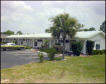 A View of the Entryways and Parking Lot at Beverly Hills Motel in Beverly Hills, Florida, B by Skip Gandy