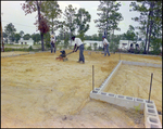 Construction Crew Packs Dirt for a Building Foundation in Beverly Hills, Florida, B by Skip Gandy