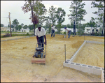 Construction Crew Packs Dirt for a Building Foundation in Beverly Hills, Florida, E by Skip Gandy