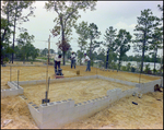 Construction Crew Packs Dirt for a Building Foundation in Beverly Hills, Florida, G by Skip Gandy