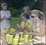 Two Women Eat Watermelon Slices in Beverly Hills, Florida by Skip Gandy