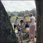 Adults Eat and Children Run Around at Picnic in Beverly Hills, Florida