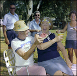 Couple Embraces and Celebrates at Picnic in Beverly Hills, Florida by Skip Gandy