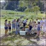 Guests Eat Watermelon Around Picnic Table in Beverly Hills, Florida, A by Skip Gandy