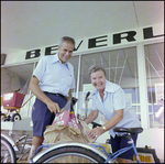 Couple Loads Charcoal Onto Bicycle in Beverly Hills, Florida, A by Skip Gandy