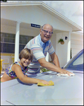 Older Man Helps Boy Wash Car in Beverly Hills, Florida, I by Skip Gandy